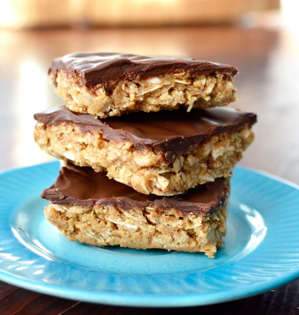 Front view of a stack of three Chocolate Peanut Butter Coconut Bars on a plate