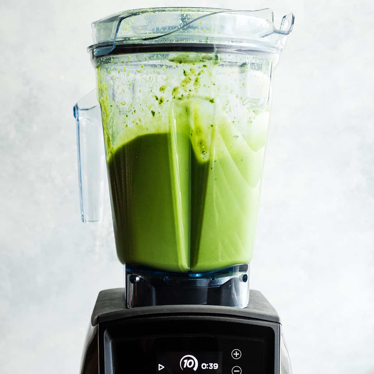 front view of a chocolate peanut butter green smoothie blending in a Vitamix blender