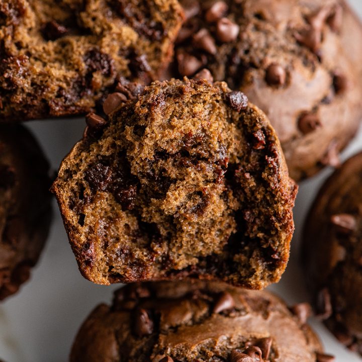 overhead view of a healthy chocolate zucchini muffin cut in half so the inside is visible