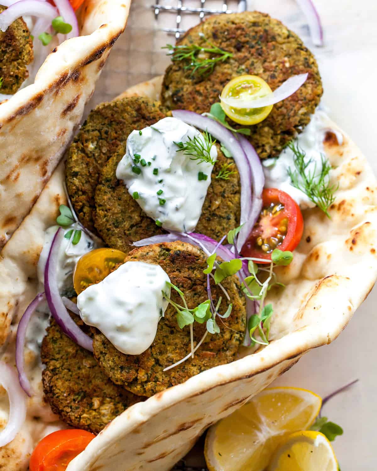overhead photo of baked falafel in a pita with tzatziki