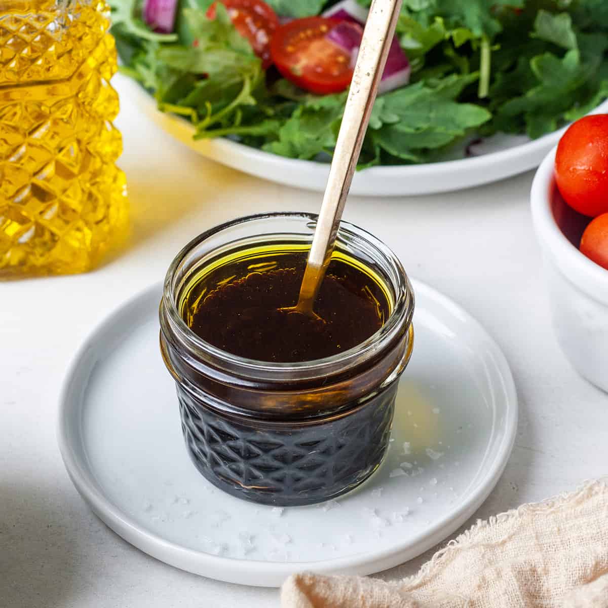Maple Balsamic Vinaigrette! 5 minutes & 5 ingredients results in the tastiest dressing you've ever made! Paleo, gluten-free, dairy-free, refined-sugar free & vegan! #homemade #dressing #salad #maple #balsamic #vinaigrette #easy #healthy #paleo #vegan maple balsamic vinaigrette dressing in a glass jar