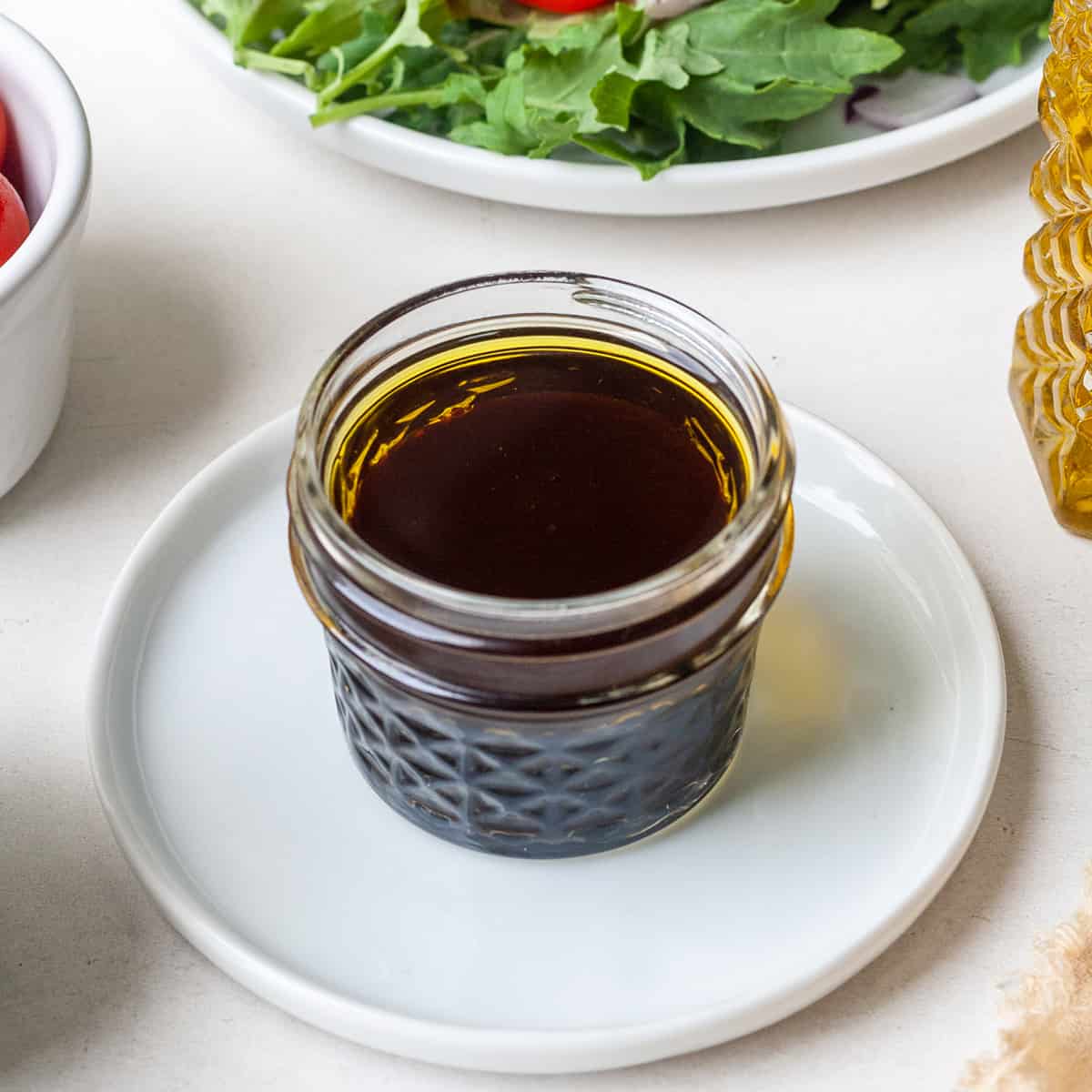 a glass jar of Maple Balsamic Vinaigrette Dressing