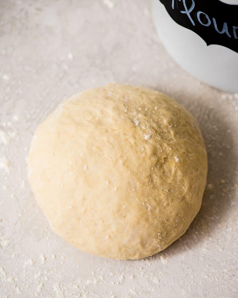 Overhead view of a ball of Easy Homemade Pizza Dough before it's rolled 