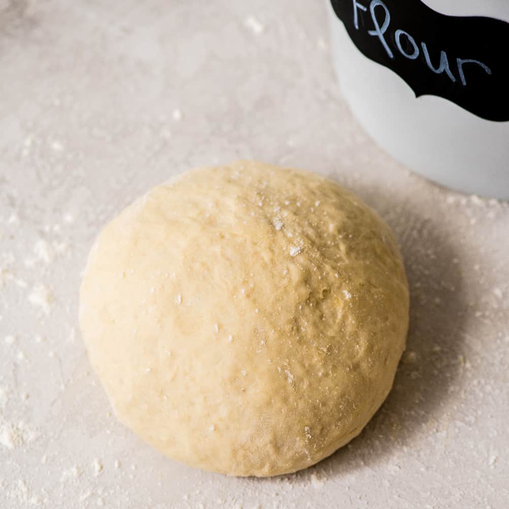 overhead view of a round circle of easy homemade pizza dough