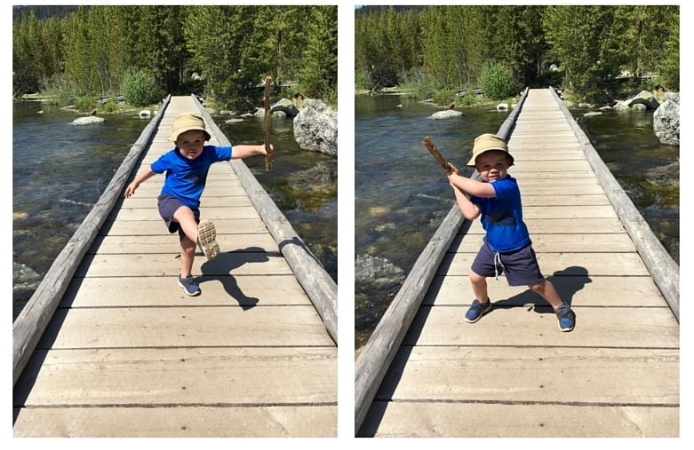 4 year old boy playing on a bridge in the mountains in The Complete Guide to Hiking with Kids