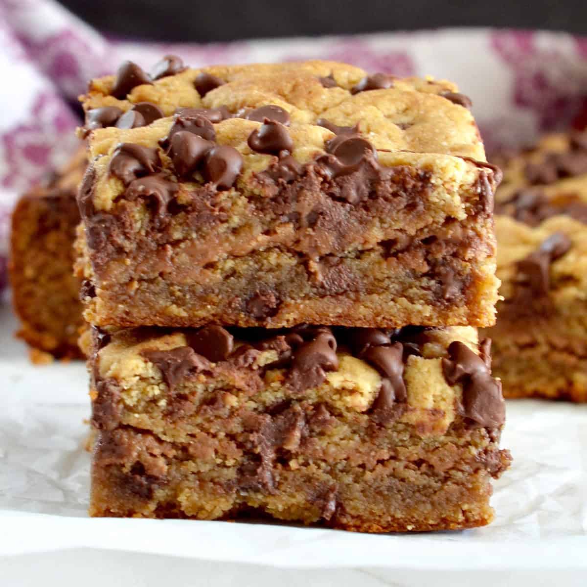 Front view of two vegan paleo blondies stacked on top of each other. 