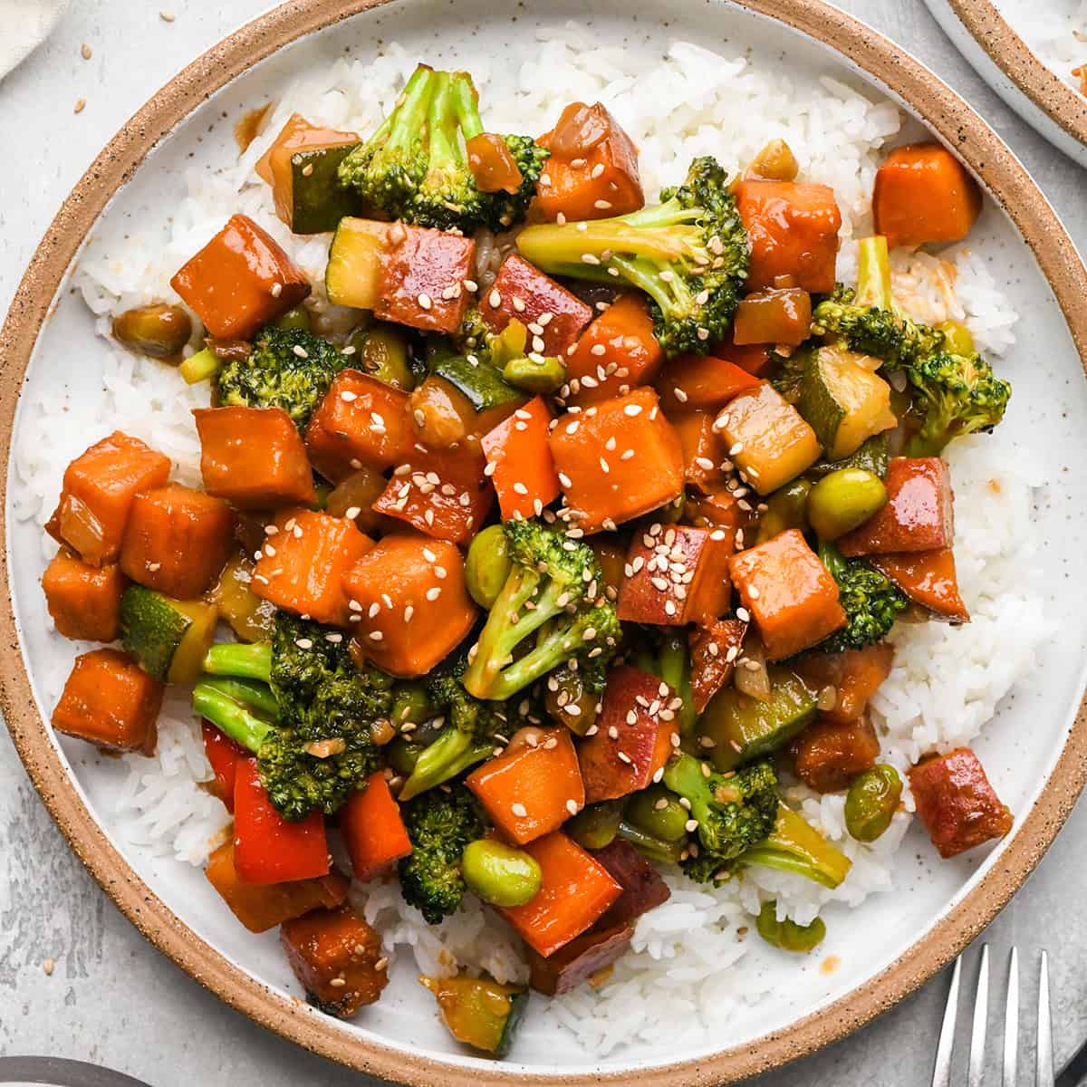 Sweet Potato Stir Fry on a plate over rice