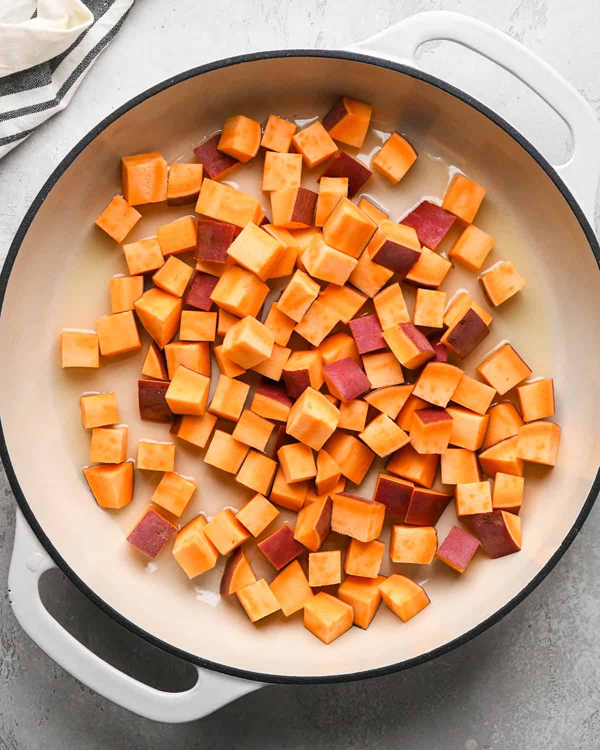 how to make Sweet Potato Stir Fry - sweet potato and peanut oil in a pan before cooking