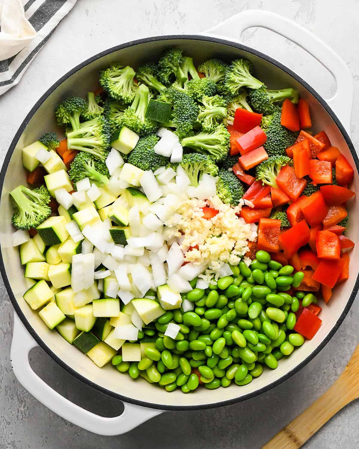 how to make Sweet Potato Stir Fry - adding vegetables to the pan before cooking