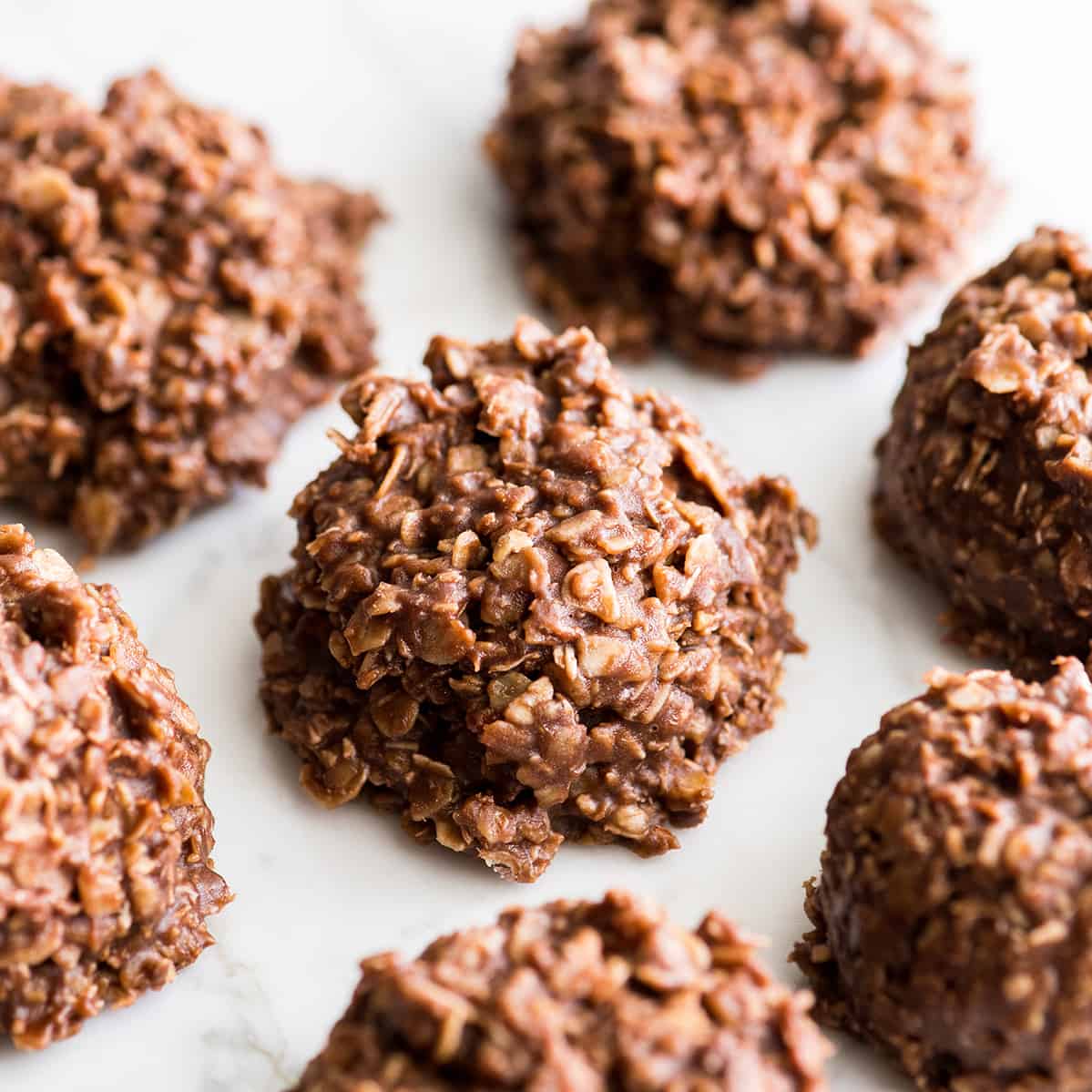7 healthy no bake cookies on a marble surface