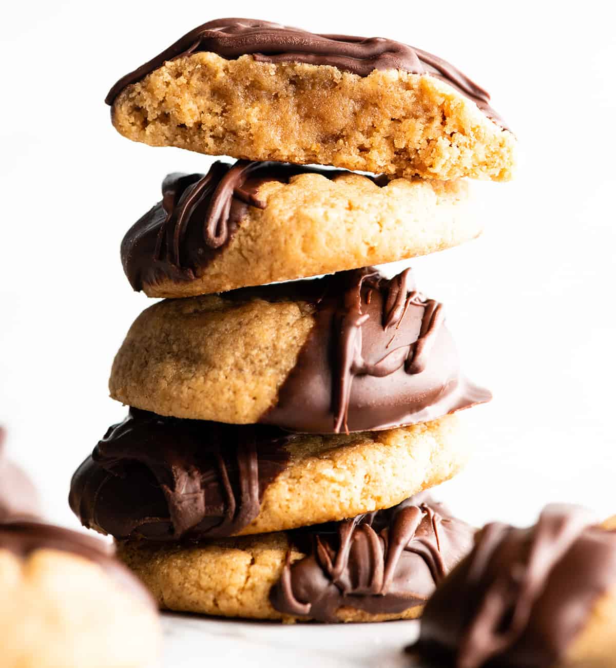 front view of a stack of 5 gluten-free peanut butter cookies dipped in chocolate
