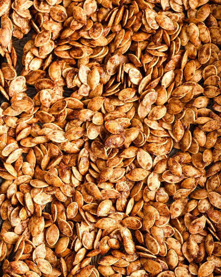 overhead view of roasted pumpkin seeds with cinnamon sgar