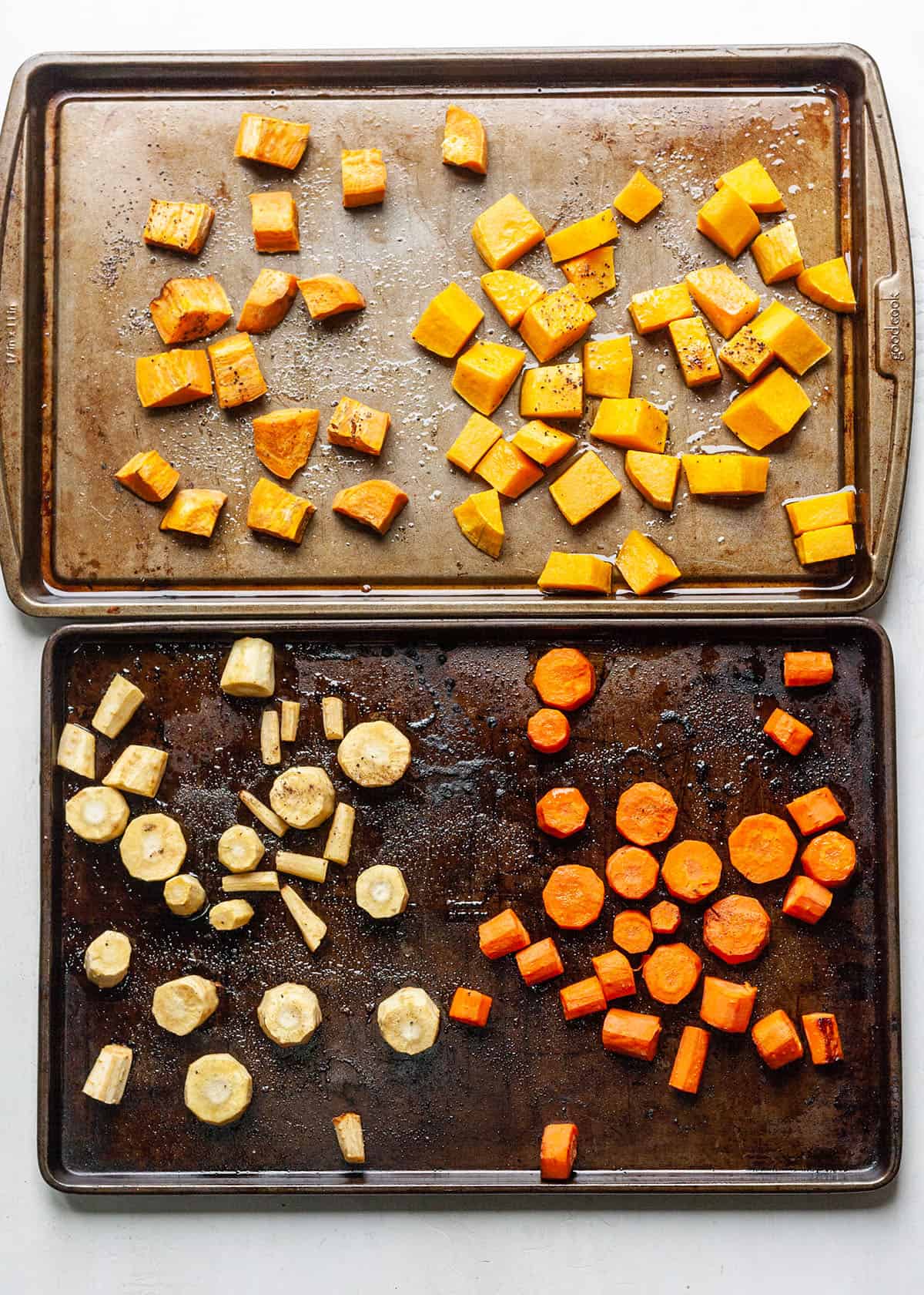 vegetables roasting on two baking sheets to make Roasted Vegetable Soup