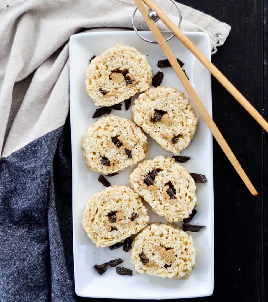 overhead view of six pieces of peanut butter chocolate Dessert Sushi on a serving plate