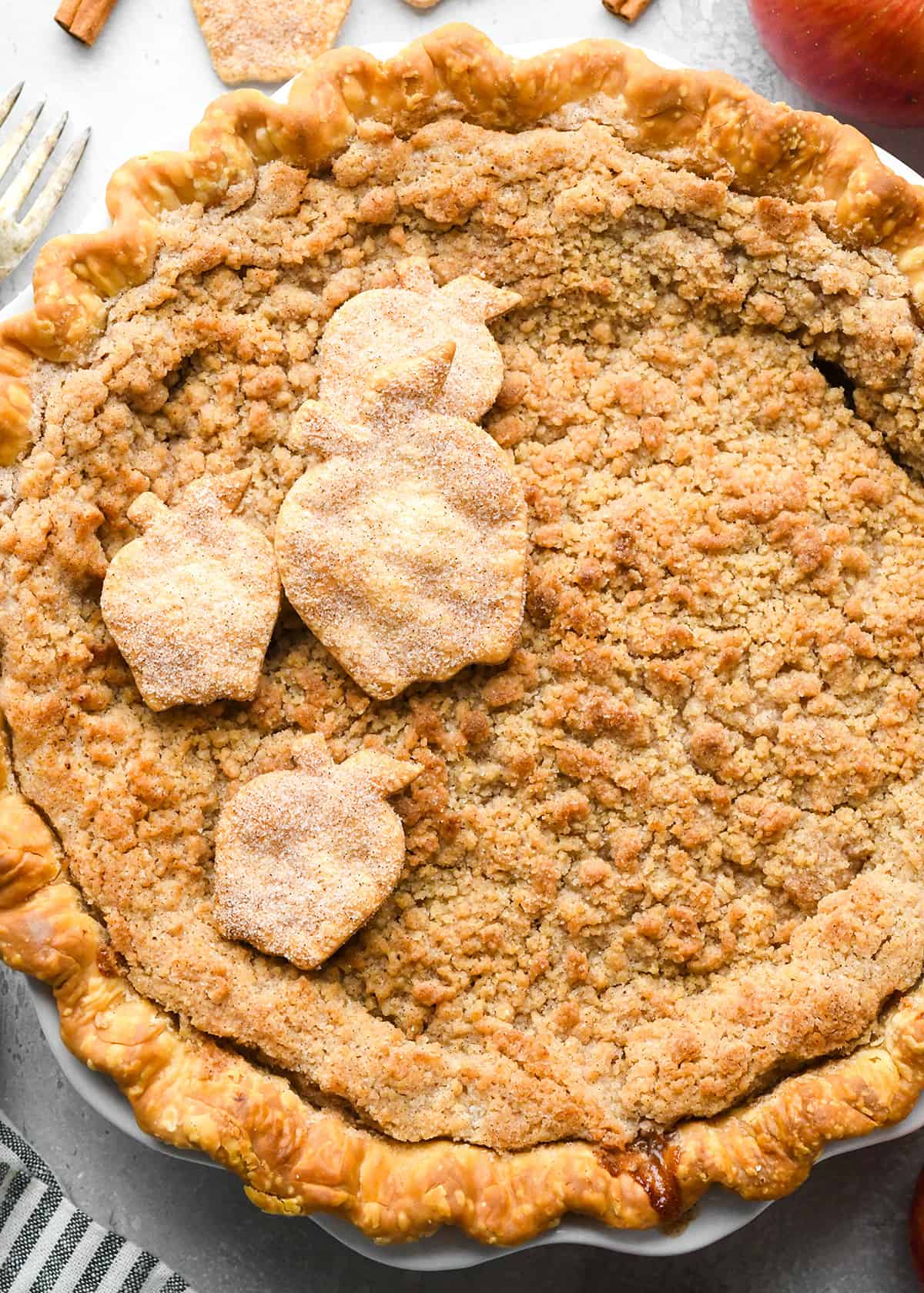baked apple crumble pie with 4 pie crust apples on top