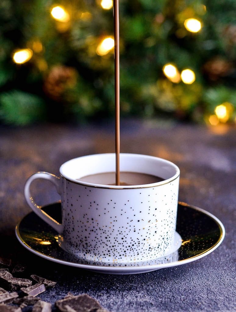 Front view of Dairy-Free Hot Chocolate being poured into a mug