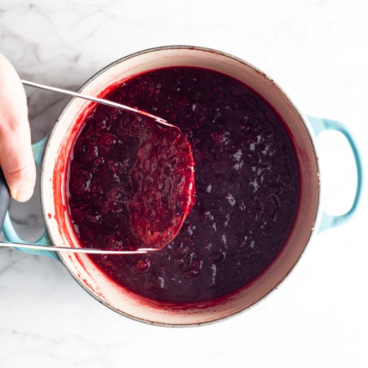 overhead photo showing how to make homemade cranberry sauce with orange juice