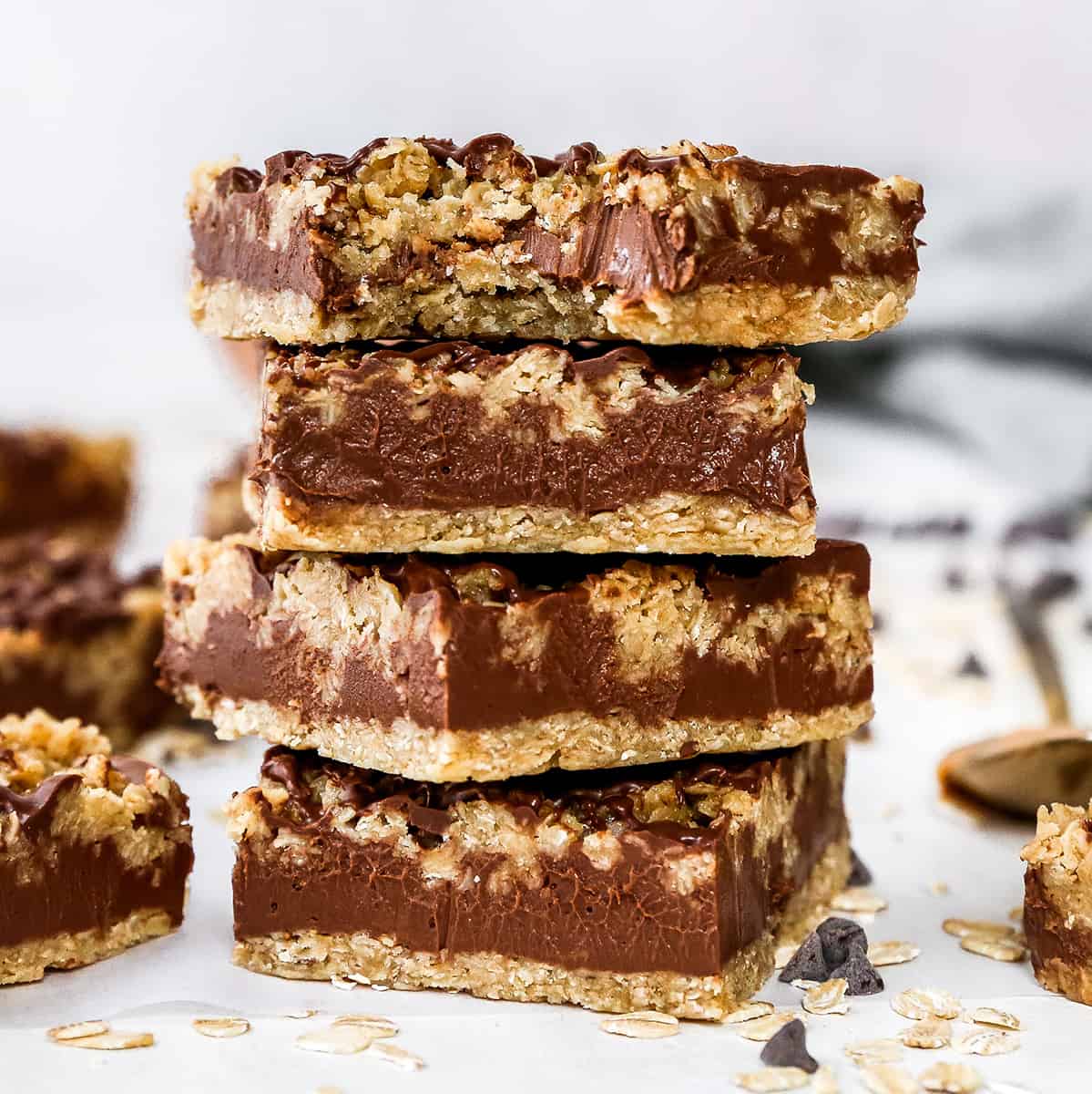 stack of 4 Chocolate Peanut Butter Oatmeal Bars, top one has a bite taken out of it