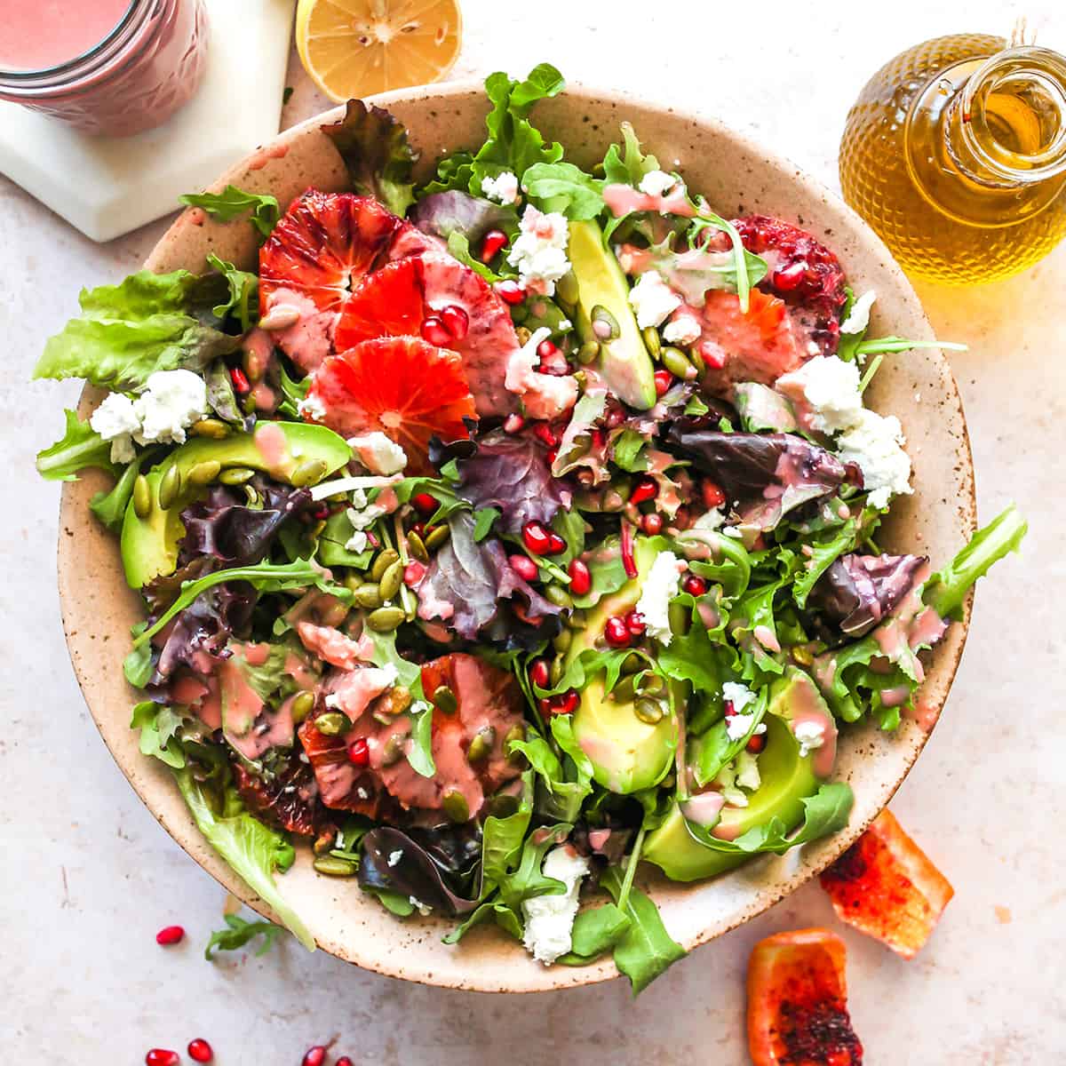 overhead view of a salad dressed with pomegranate vinaigrette