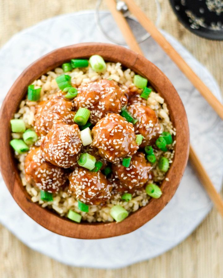 Overhead view of healthy Paleo Sweet and Sour Meatballs in a bowl with rice 