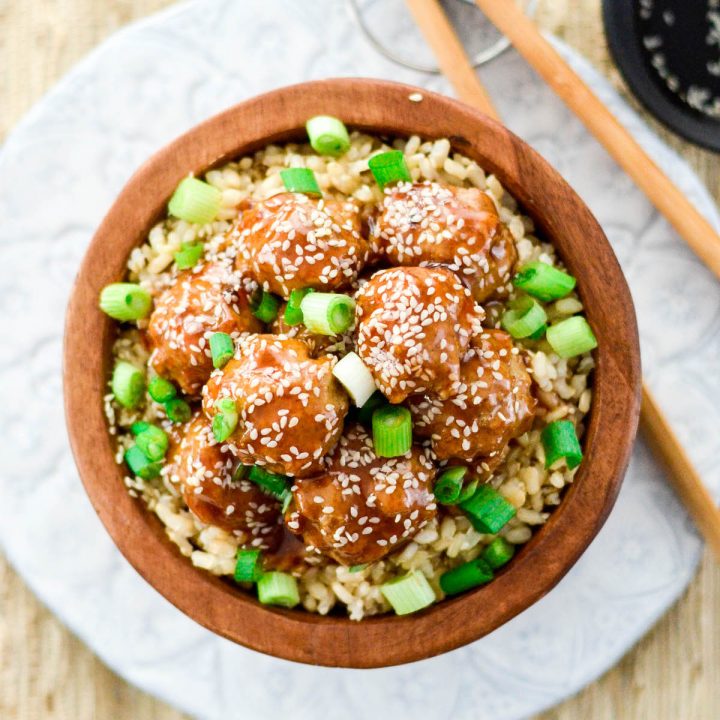 Overhead view of Healthy Paleo Sweet and Sour Meatballs in a bowl with rice