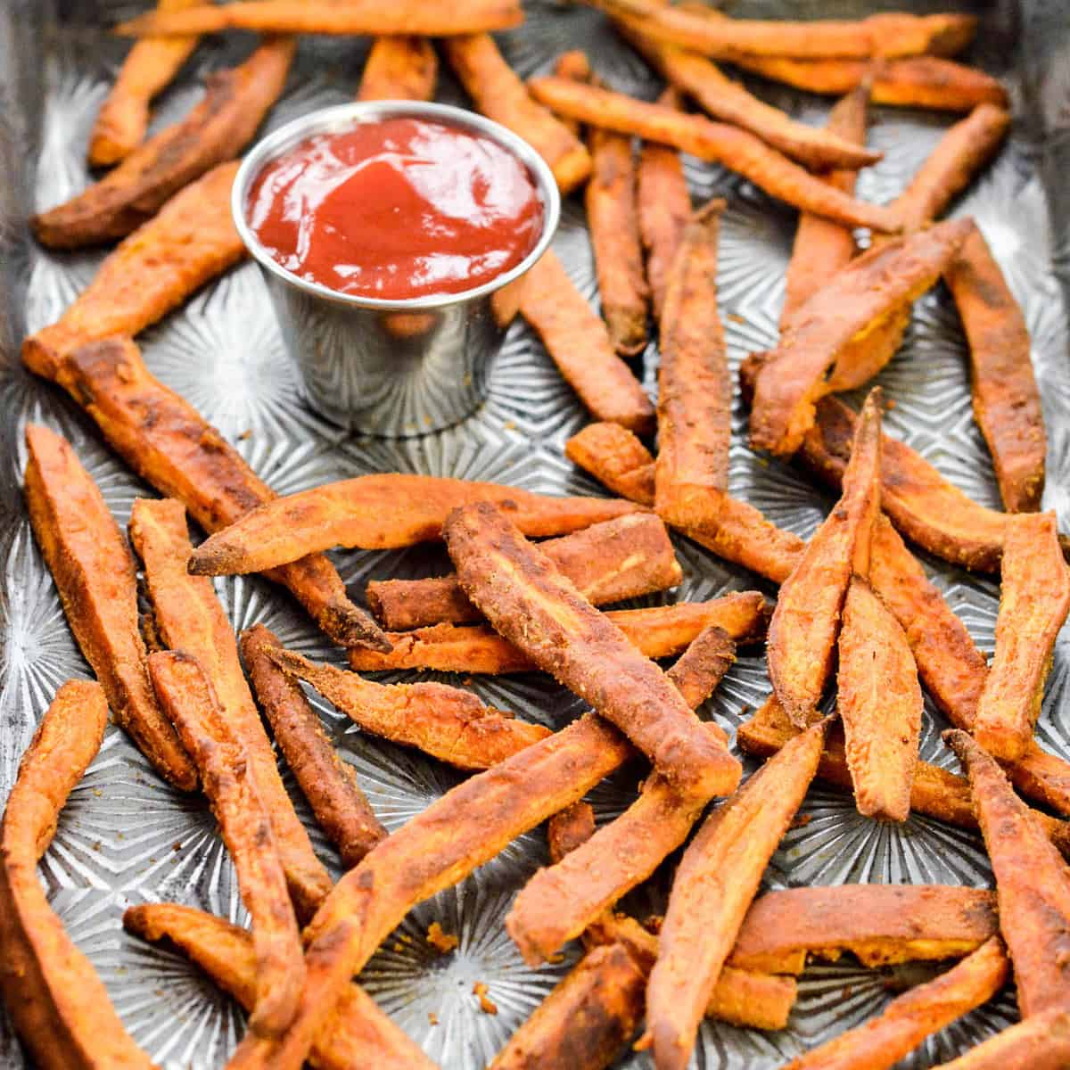 Front view of Peanut Butter Sweet Potato Fries on a baking sheet