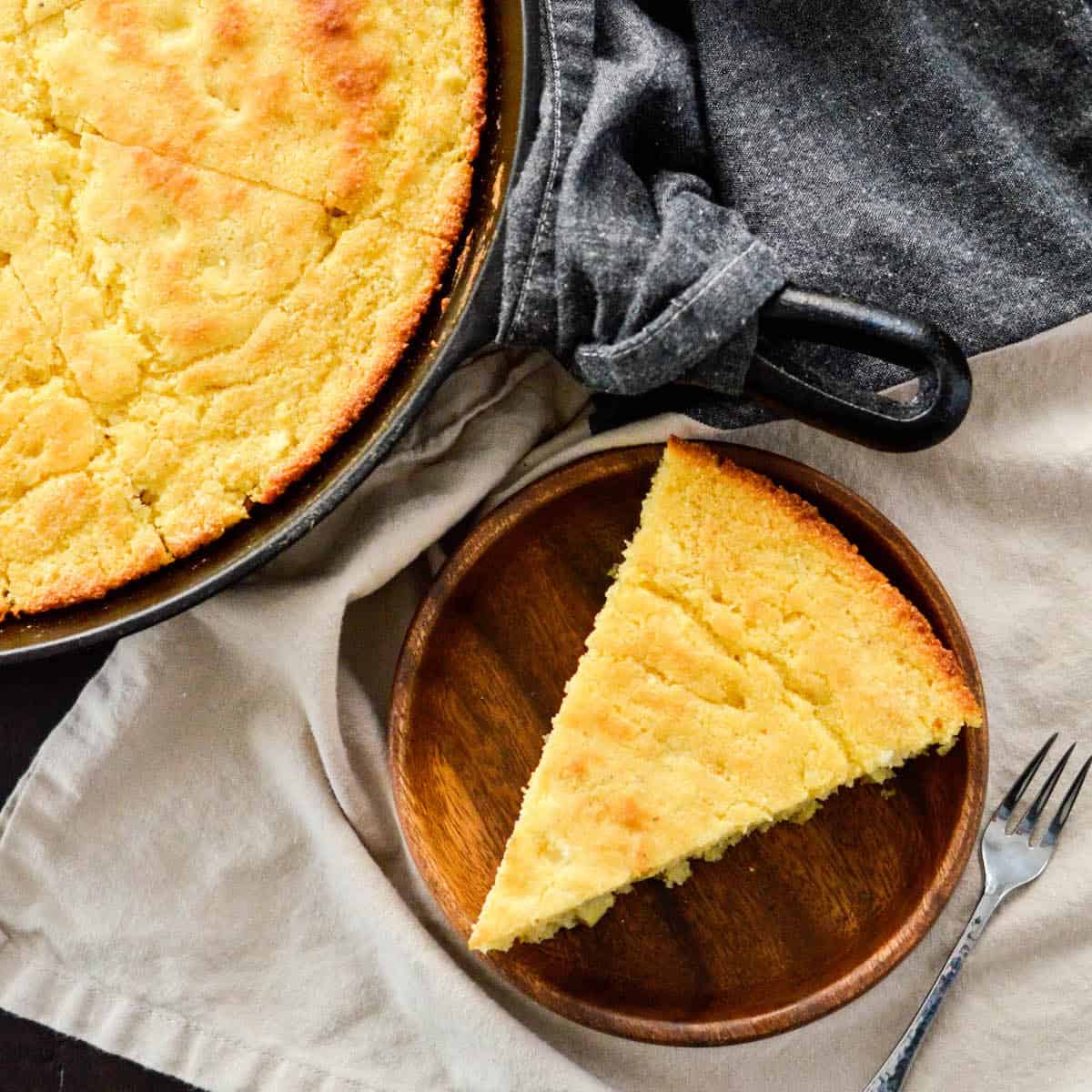 a piece of Healthy Skillet Cornbread on a plate