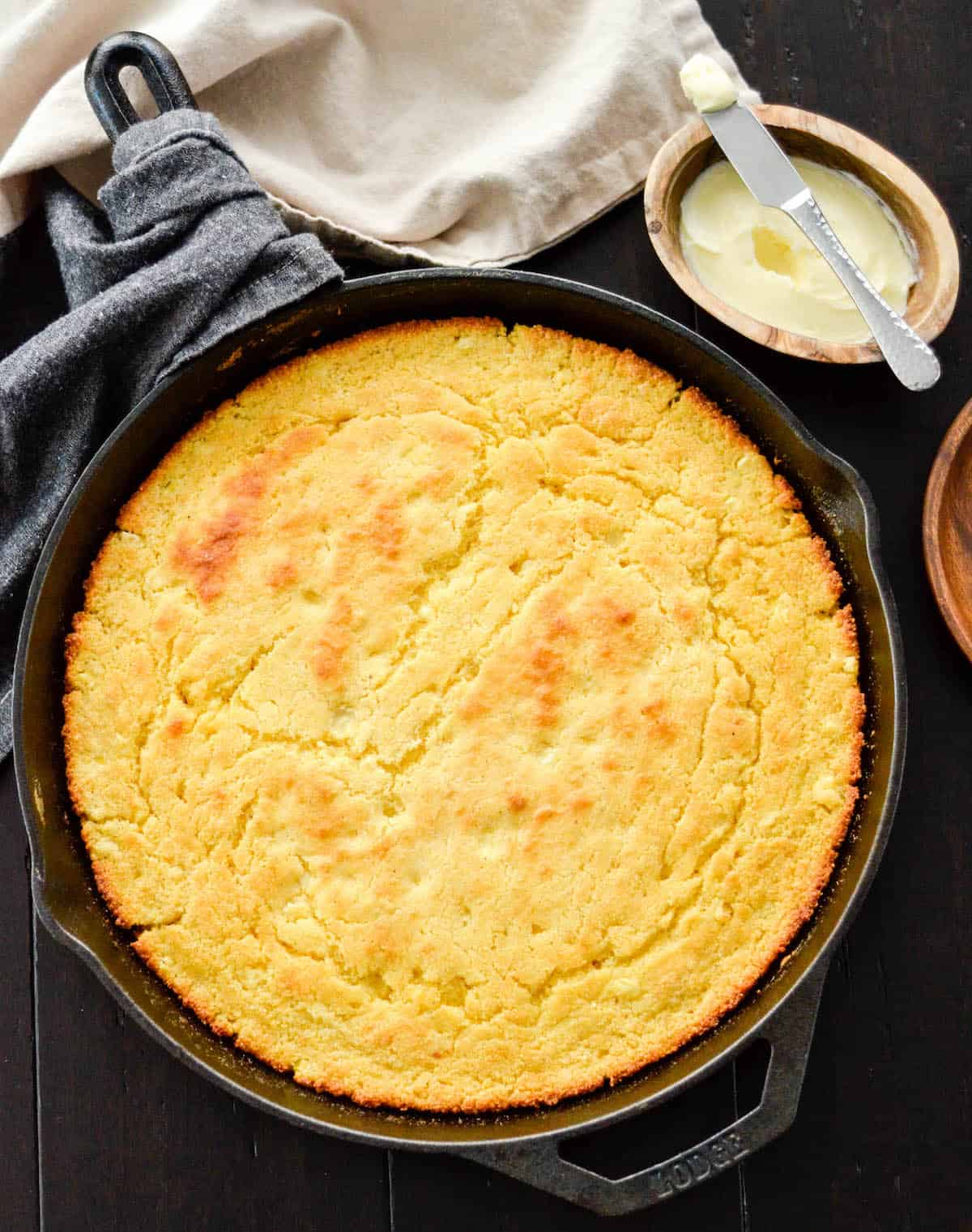Overhead view of healthy skillet cornbread recipe in a cast iron skillet