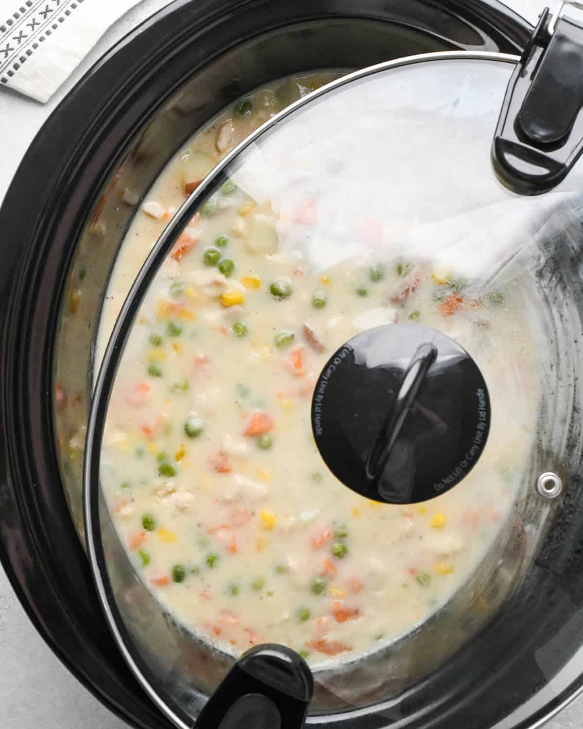 making Chicken Pot Pie Soup - cooking in the crock pot with the lid slightly ajar