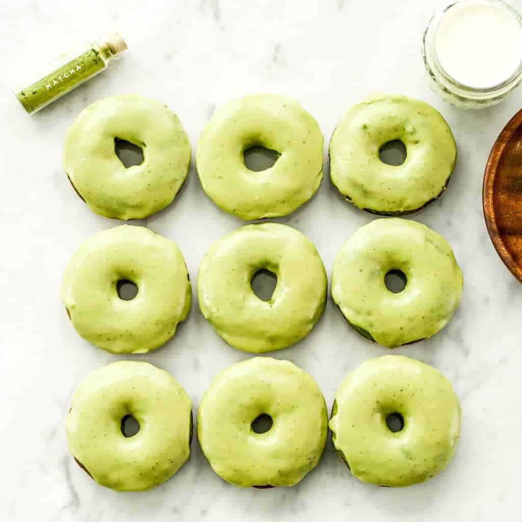 Overhead view of 9 Paleo Spinach Donuts arranged in 3 rows of 3
