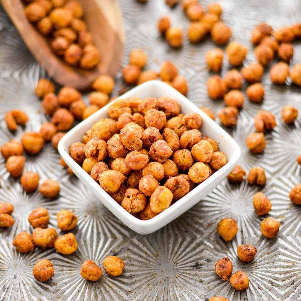 Side view of a square dish full of crunchy roasted chickpeas