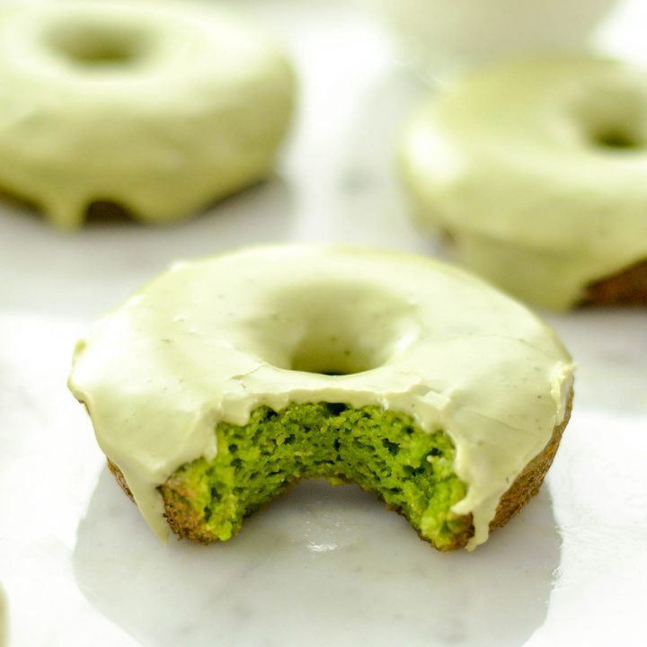 front view of one Paleo Spinach Donut with a bite taken out of it