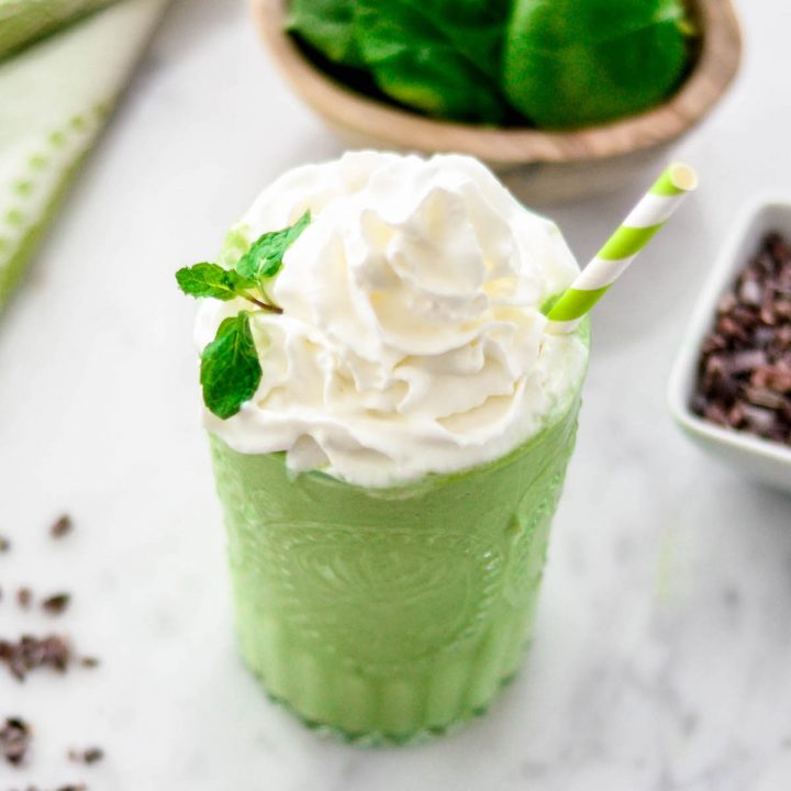 healthy shamrock shake with whipped cream and fresh mint