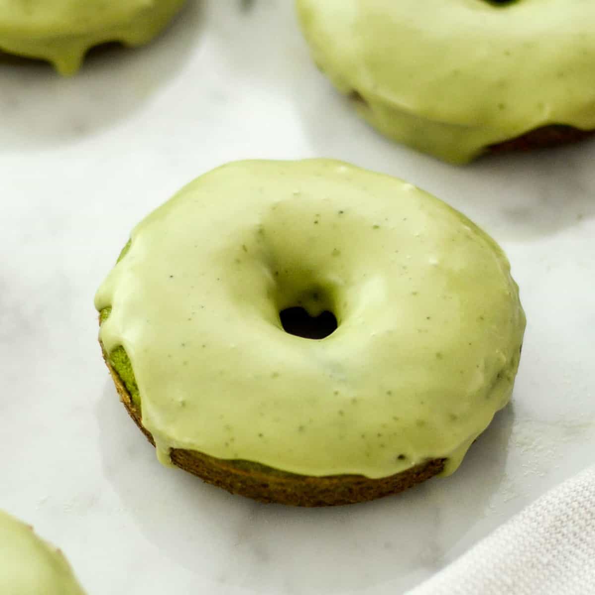 a paleo spinach donut with glaze