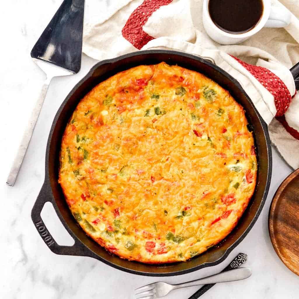 overhead view of a baked Gluten-Free Crustless Quiche in a cast iron skillet