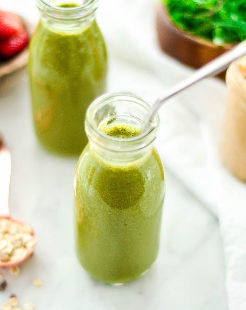 close up view of a bottle filled with Chocolate Peanut Butter Green Smoothie 