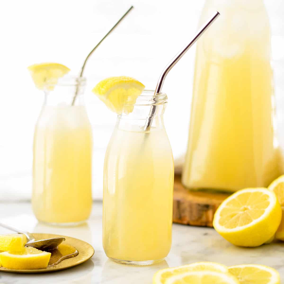 Orange Blossom Lemonade in two glasses and a pitcher