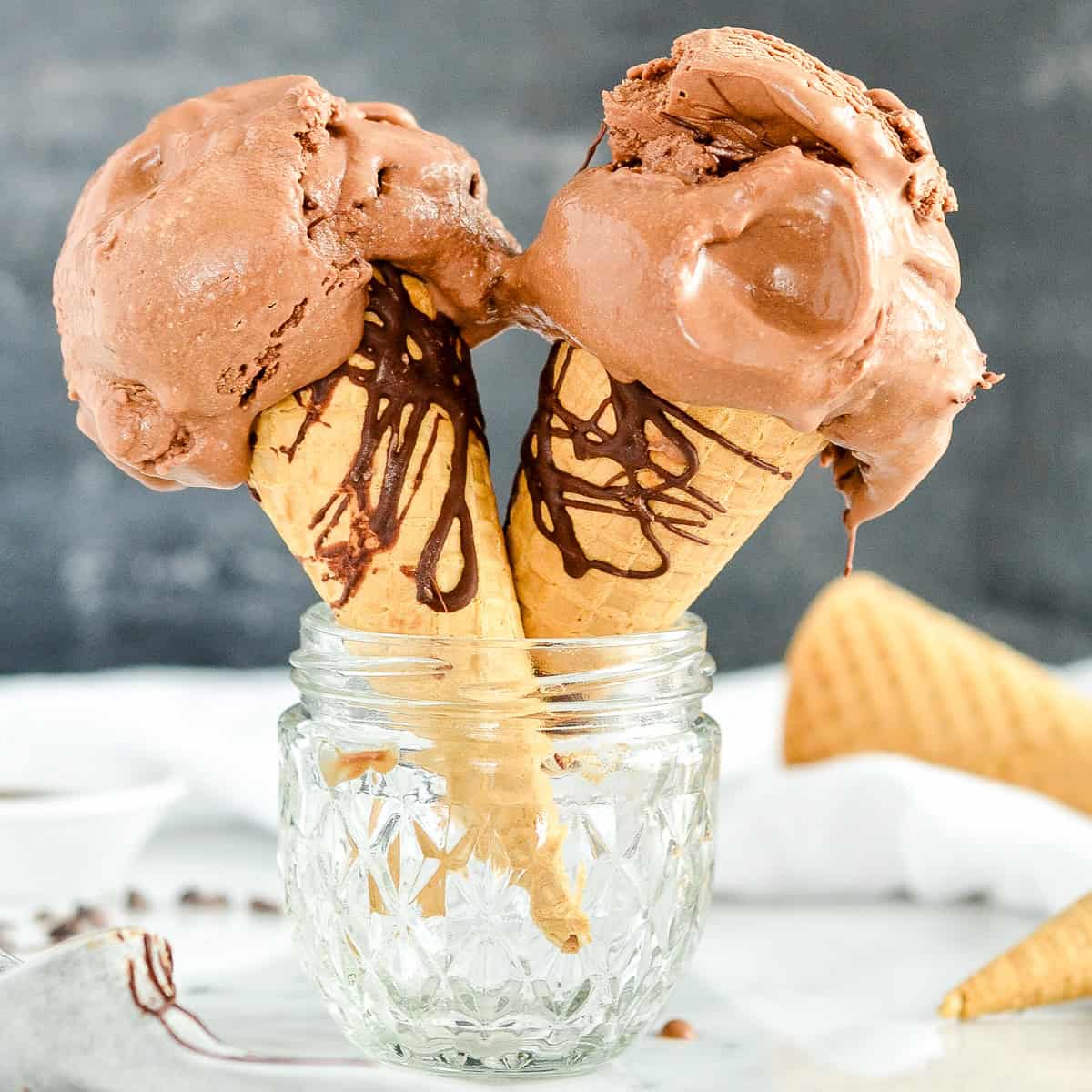 two ice cream cones with Paleo Chocolate Ice Cream