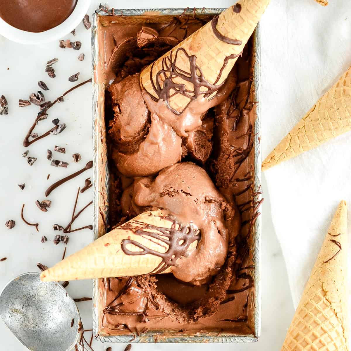 Paleo Chocolate Ice Cream in a dish with ice cream cones