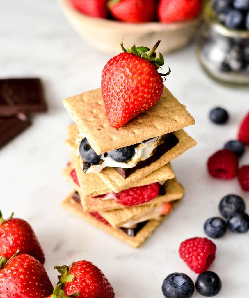 overhead view of a stack of three Dark Chocolate S'mores with Fresh Berries