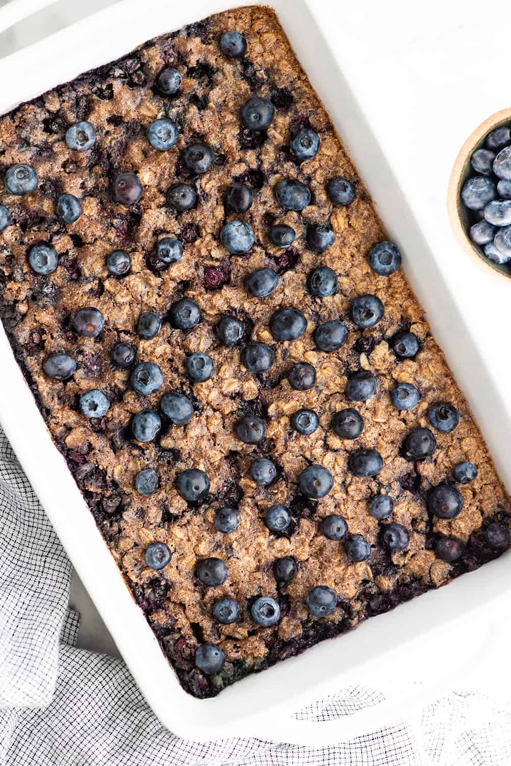 overhead view of a baking dish with blueberry baked oatmeal in it