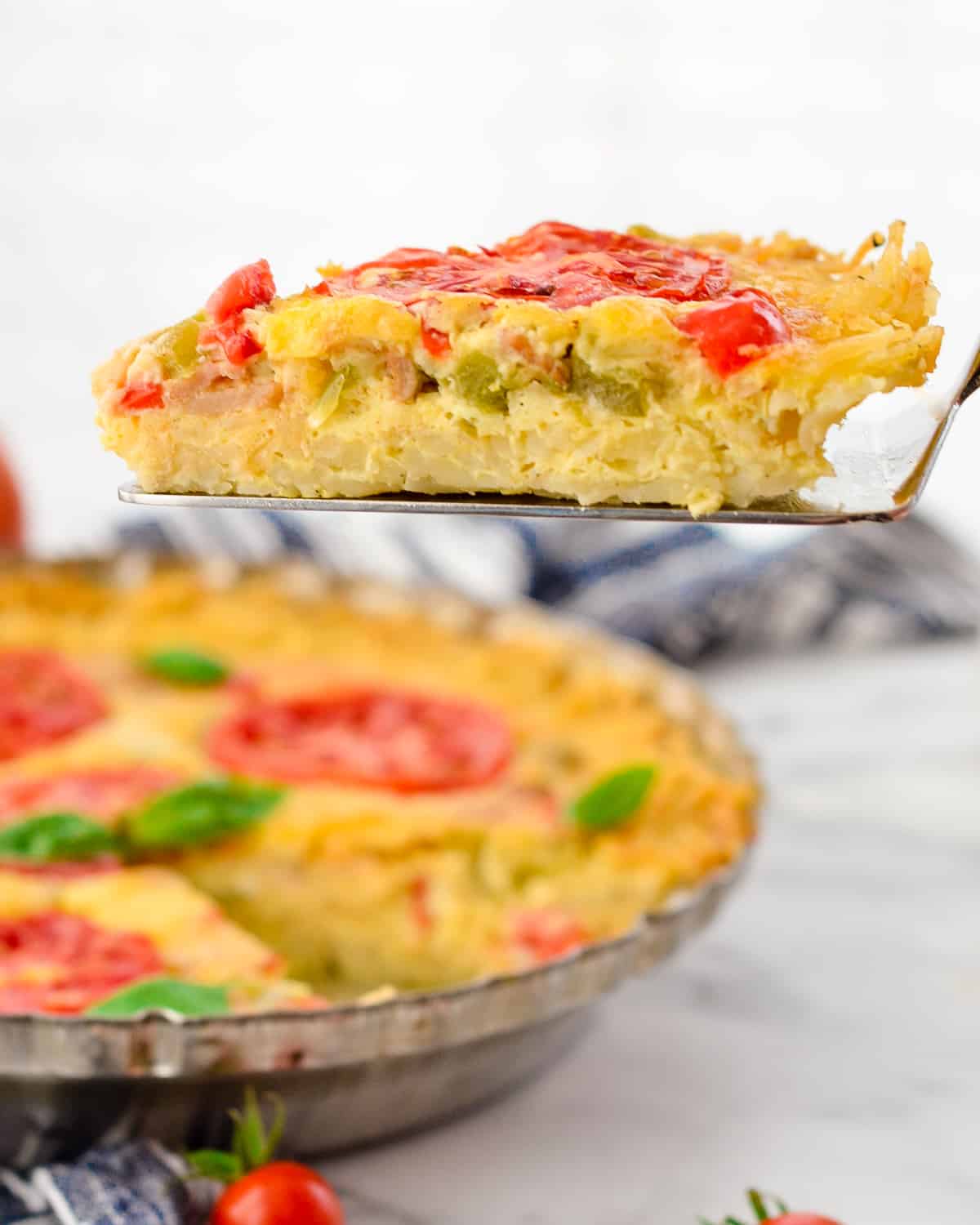 Side view of a one piece of Gluten-Free Hash Brown Quiche 