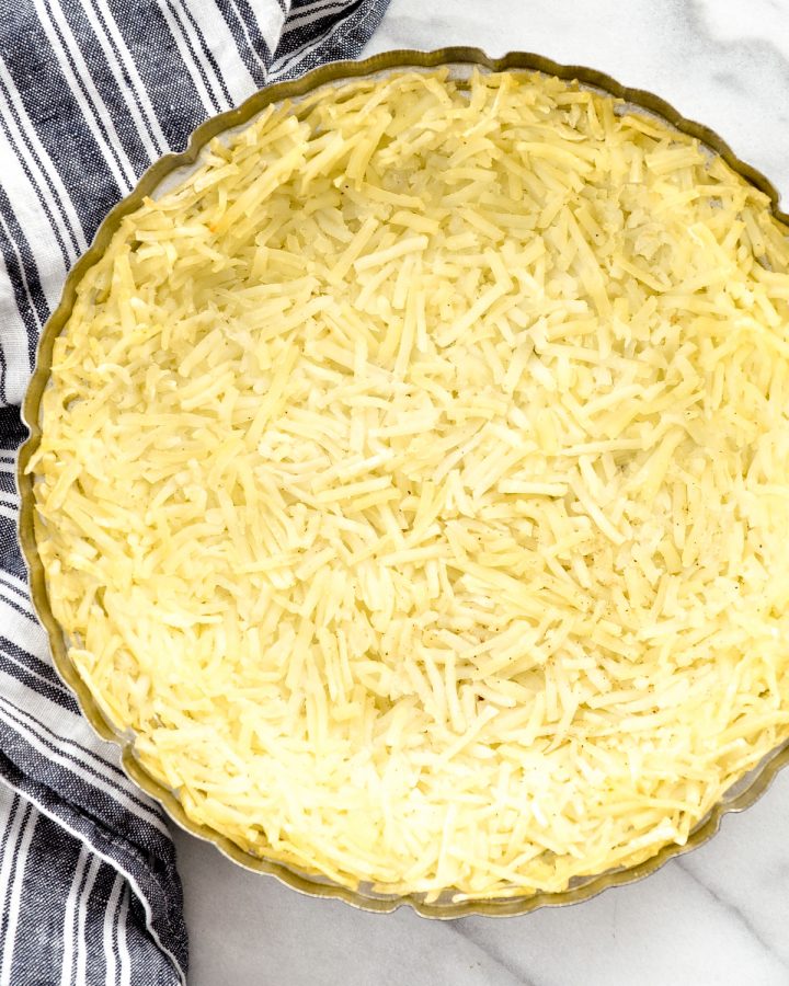 Overhead view of the hash brown crust being made in Gluten-Free Hash Brown Quiche 