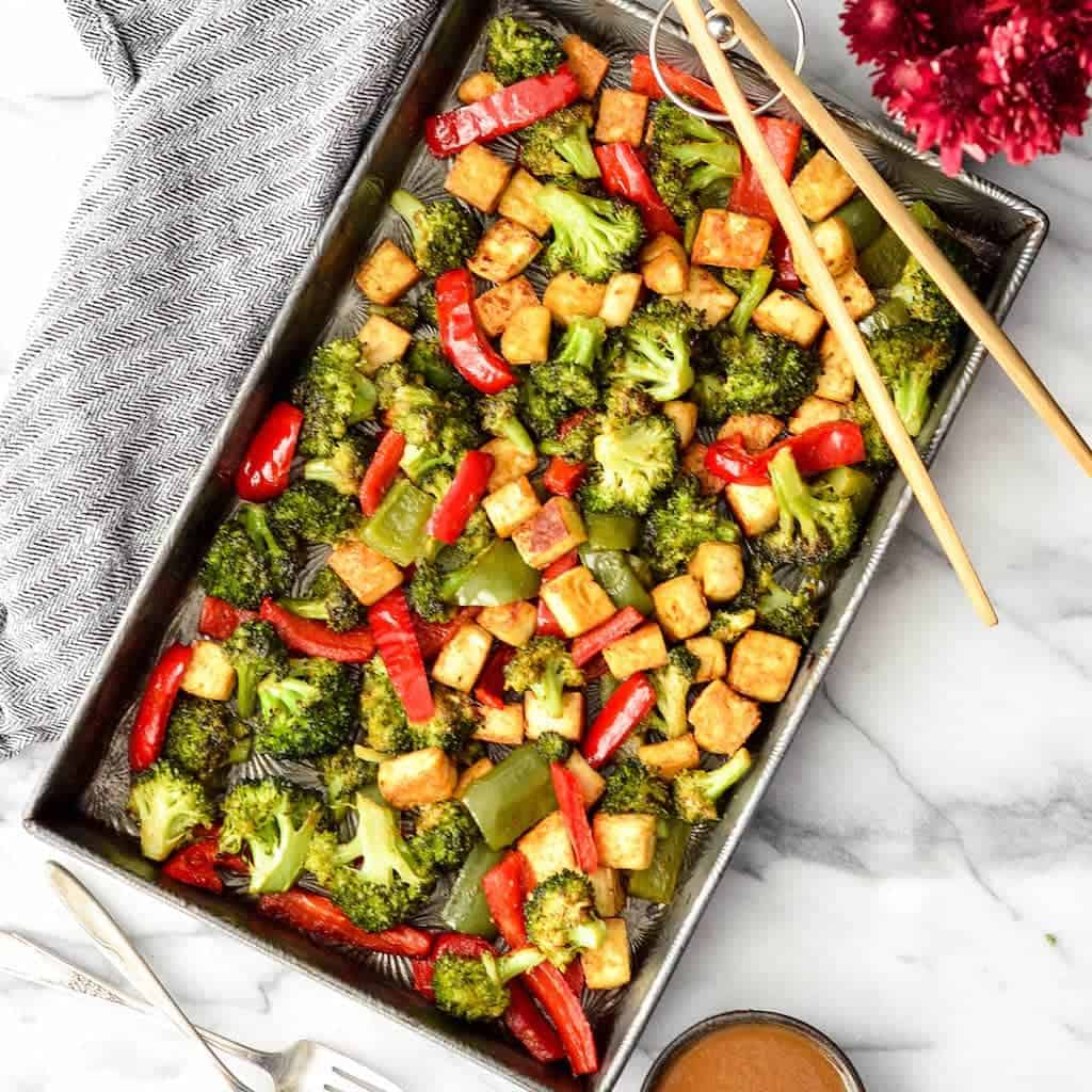 Sheet Pan Crispy Tofu & Vegetables with Peanut Sauce. An easy, healthy dinner recipe that's gluten-free, dairy-free & vegan-friendly!