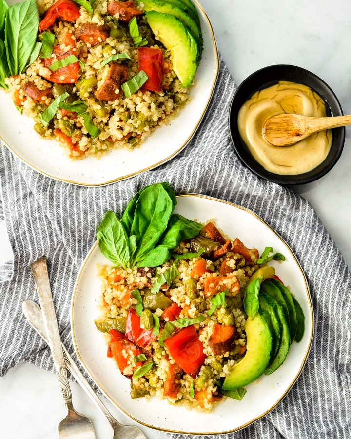 Overhead view of two plates of Roasted Vegetable Quinoa Salad
