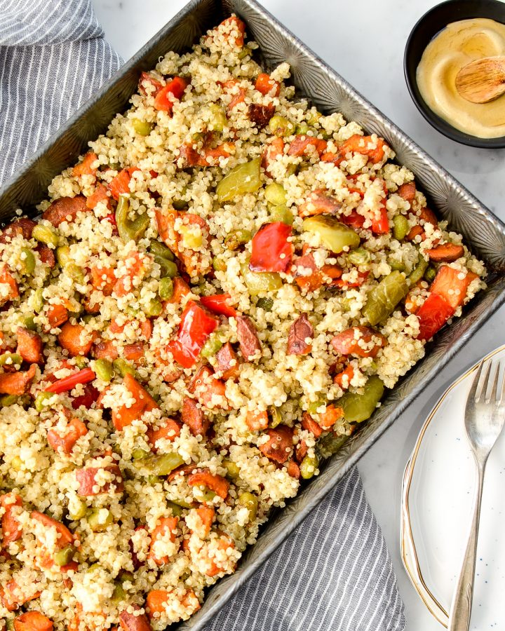 Overhead view of roasted vegetable quinoa salad in a baking pan