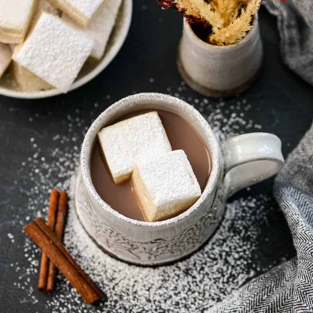 Overhead view of a mug of hot cocoa with two Homemade Marshmallows Recipe in it