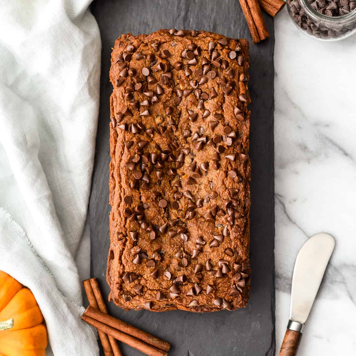 overhead view of a whole loaf of paleo pumpkin bread with chocolate chips 