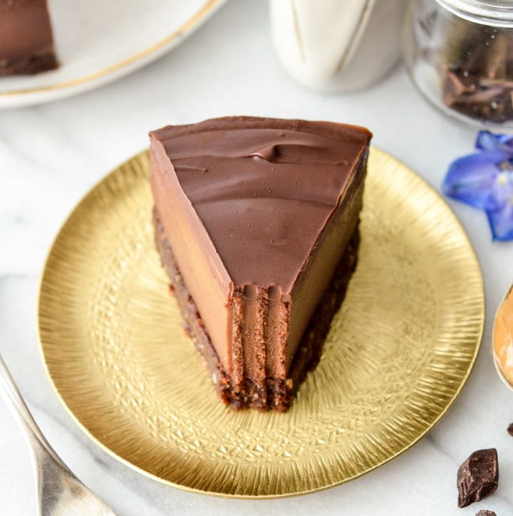 This no-bake vegan chocolate peanut butter cheesecake is a healthy and decadent dessert! It's gluten-free, dairy-free, vegan, and paleo-friendly!