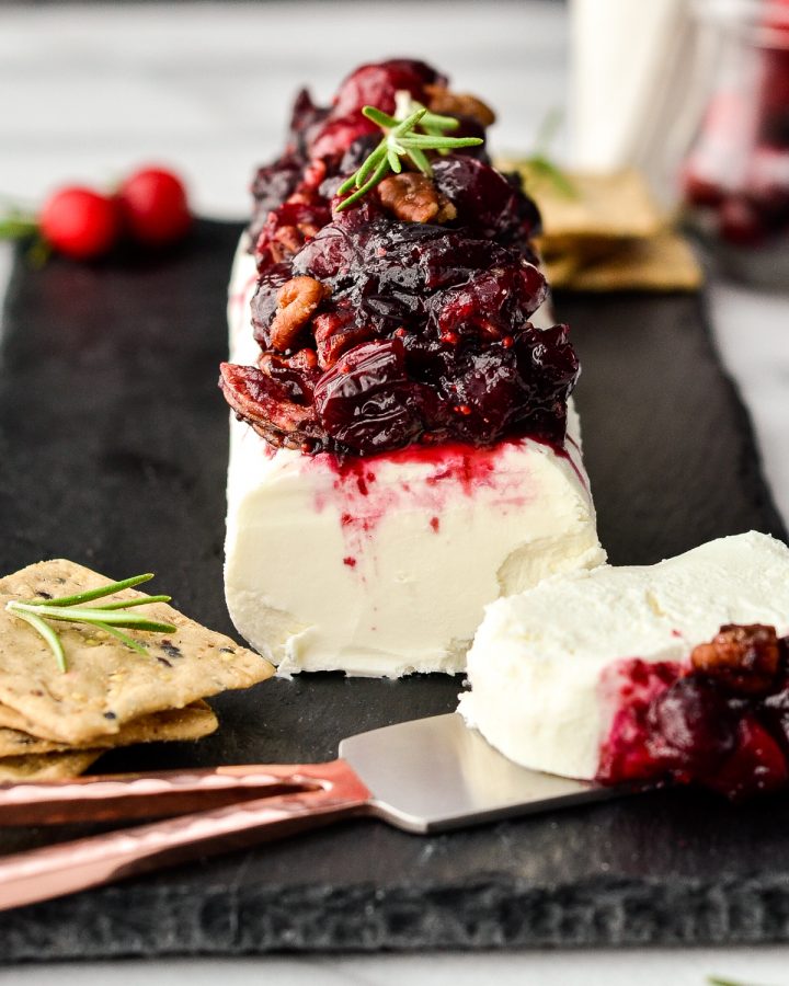 Cranberry Goat Cheese Appetizer being served with a cheese knife